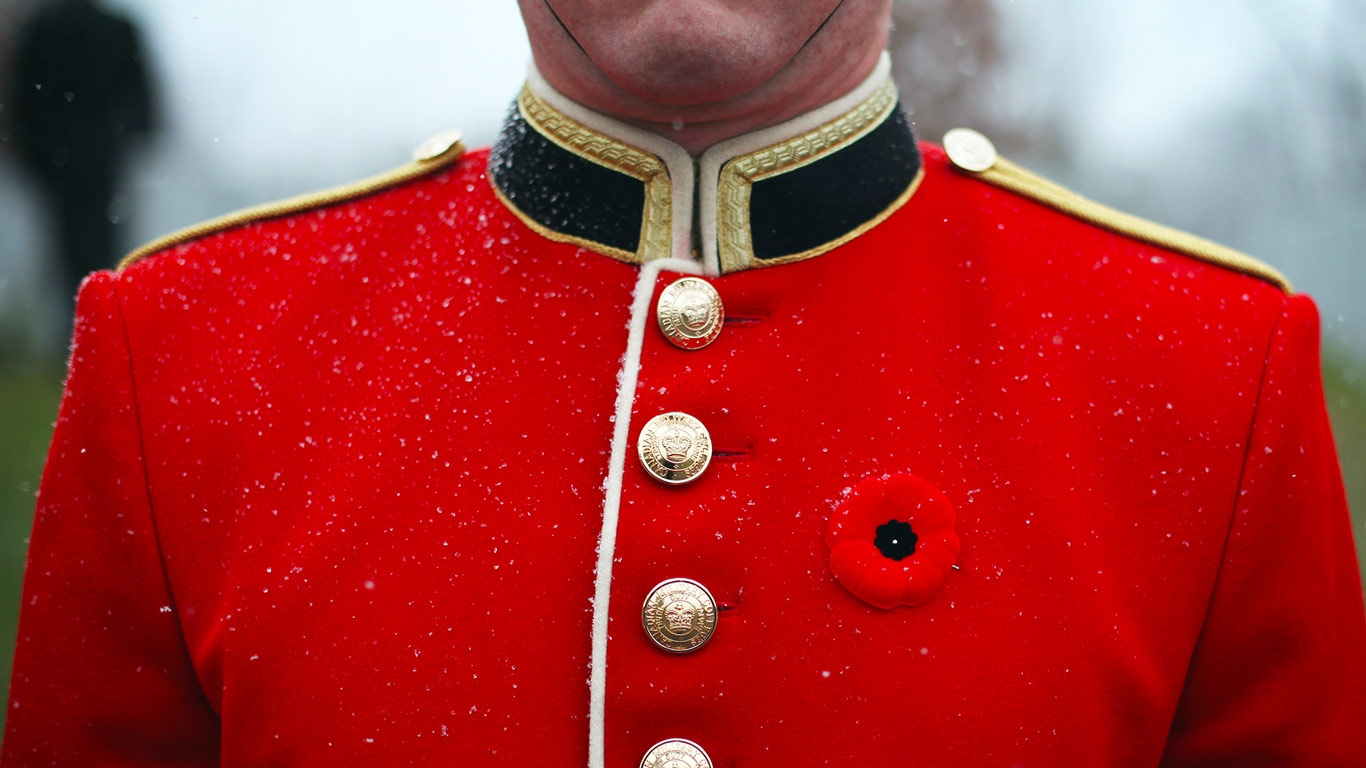 The Post A Member Of Canadian Armed Forces Wears Poppy Prior To
