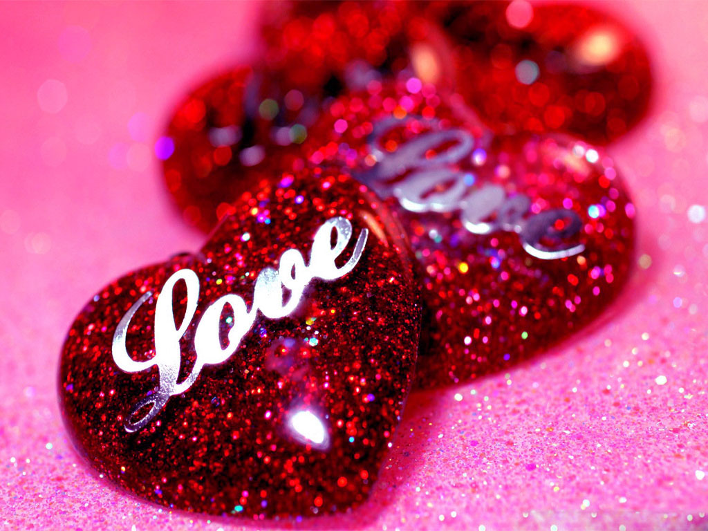 Glittering Red Hearts with 'Love' Inscription on Pink Glitter Background