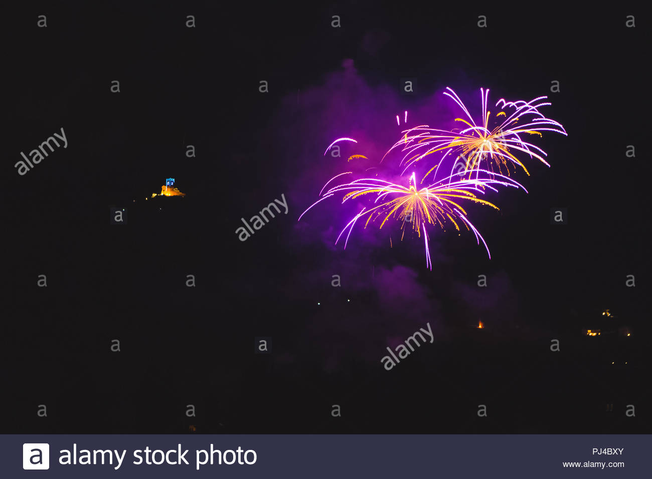 Purple Fireworks With Illuminated Church Of The Patron Saint