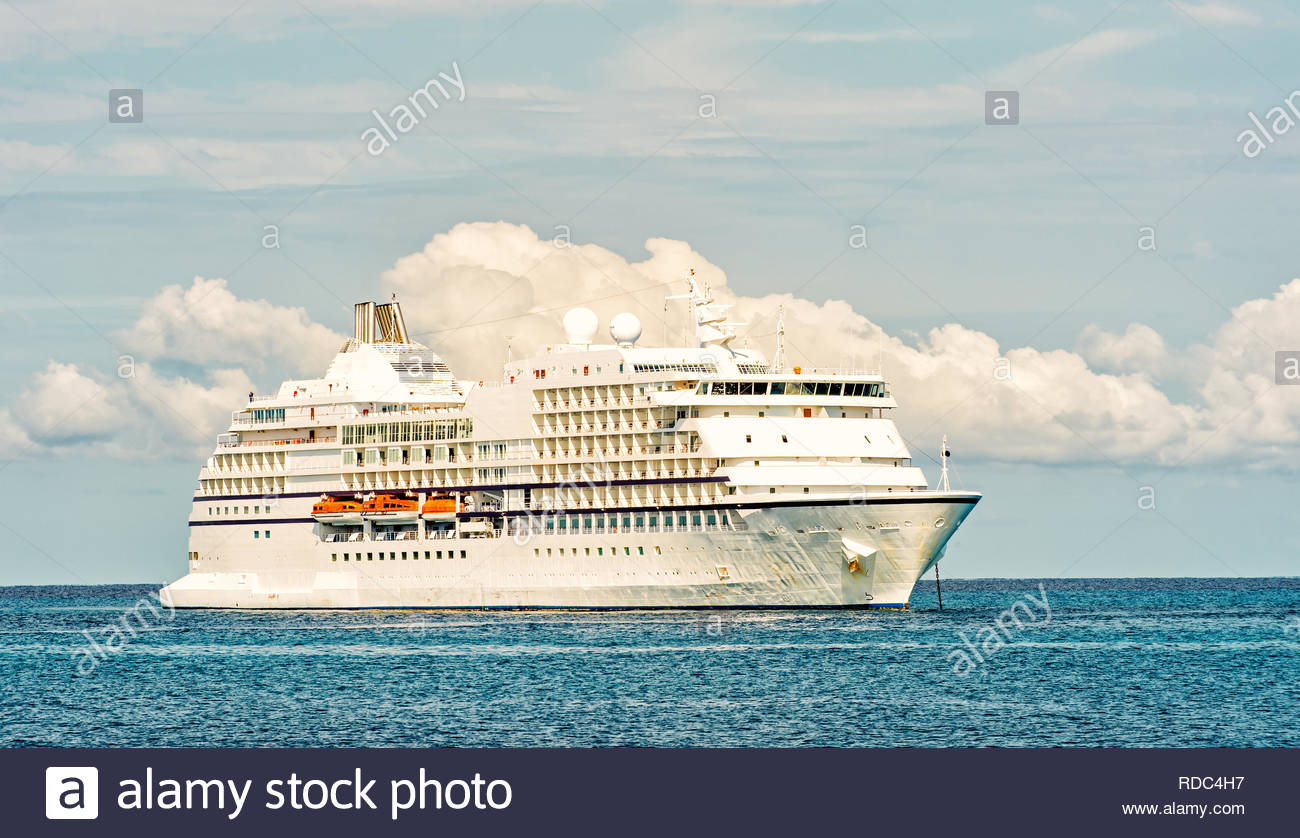 Large Luxury Cruise Ship On Sea Water And Cloudy Sky Background At