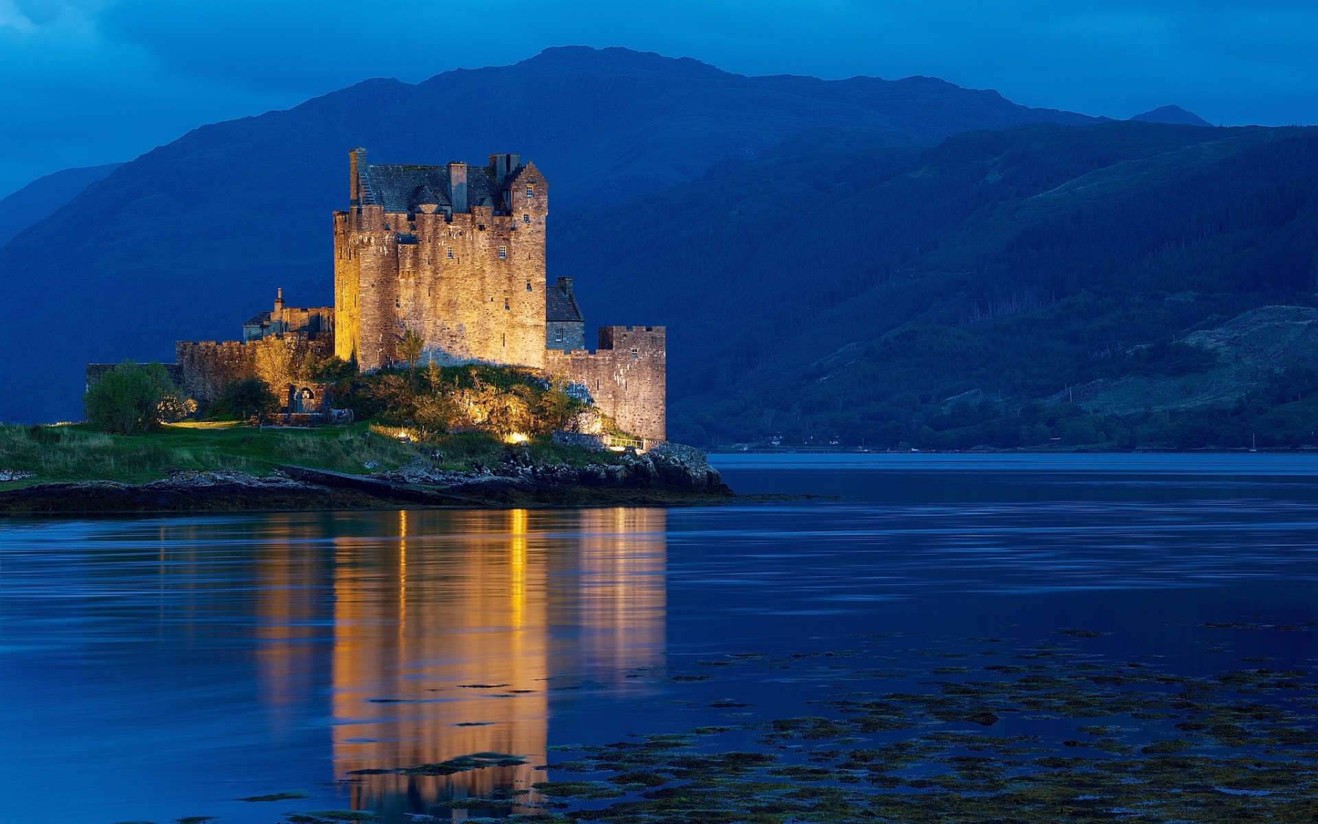 Eilean Donan Castle at dusk in the Scottish Highlands