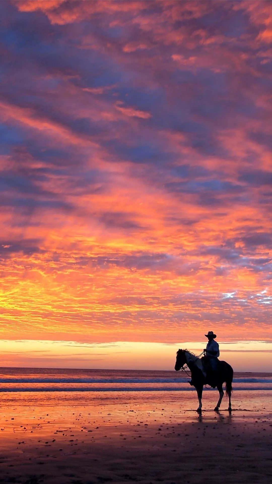 Sunset By The Beach Cowboy iPhone Wallpaper