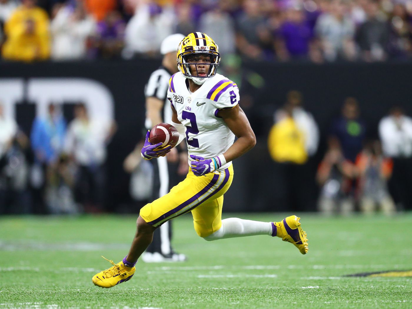 Justin Jefferson running with the football during an LSU game