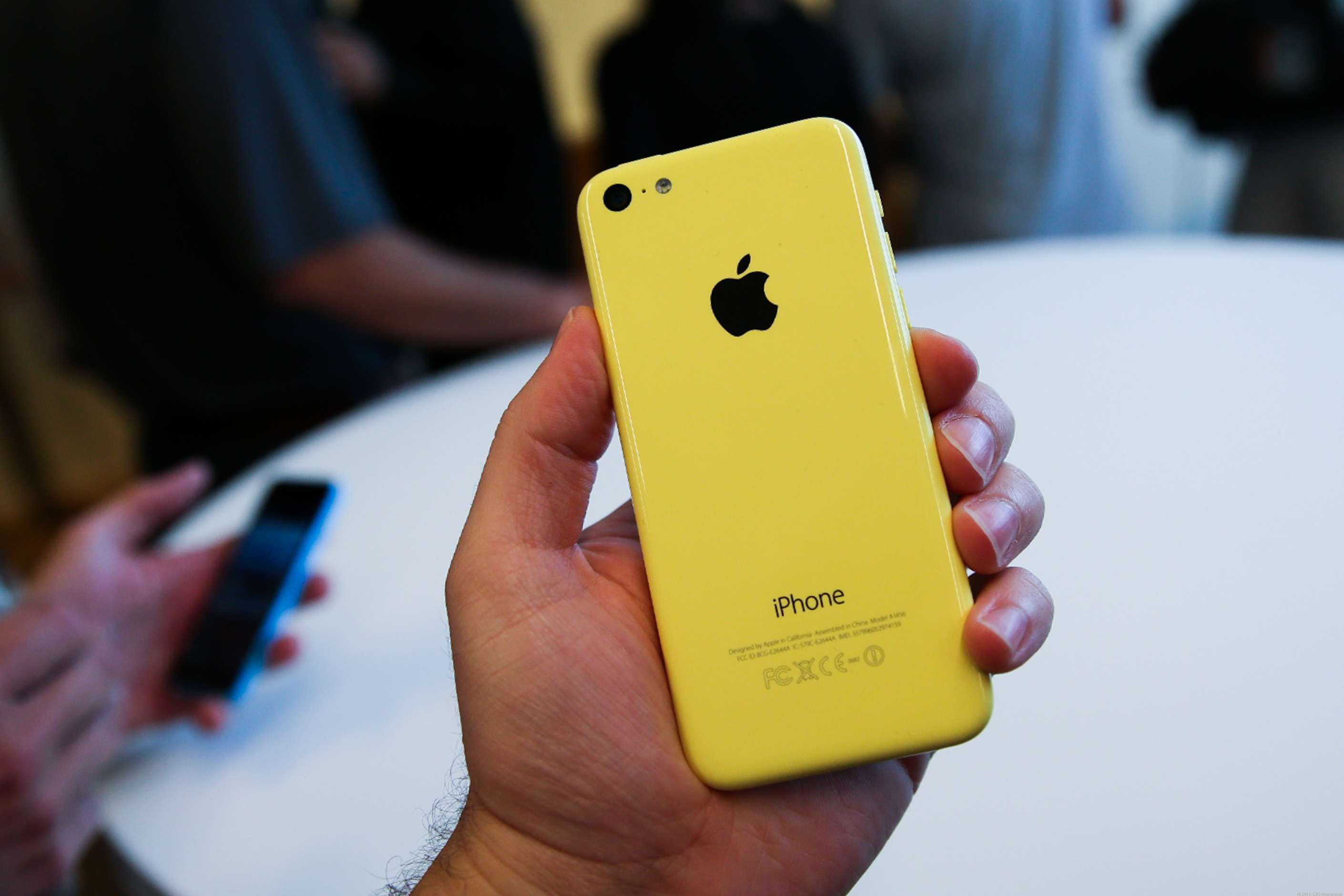 Yellow iPhone 5c In Hand Wallpaper And Image Pictures