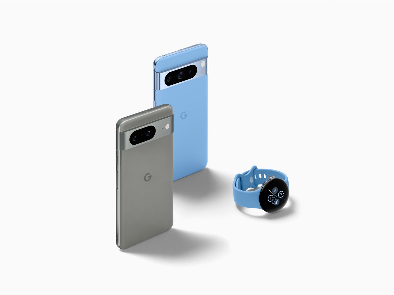 Google Pixel 7 phones in silver and light blue with matching Google Pixel Watch