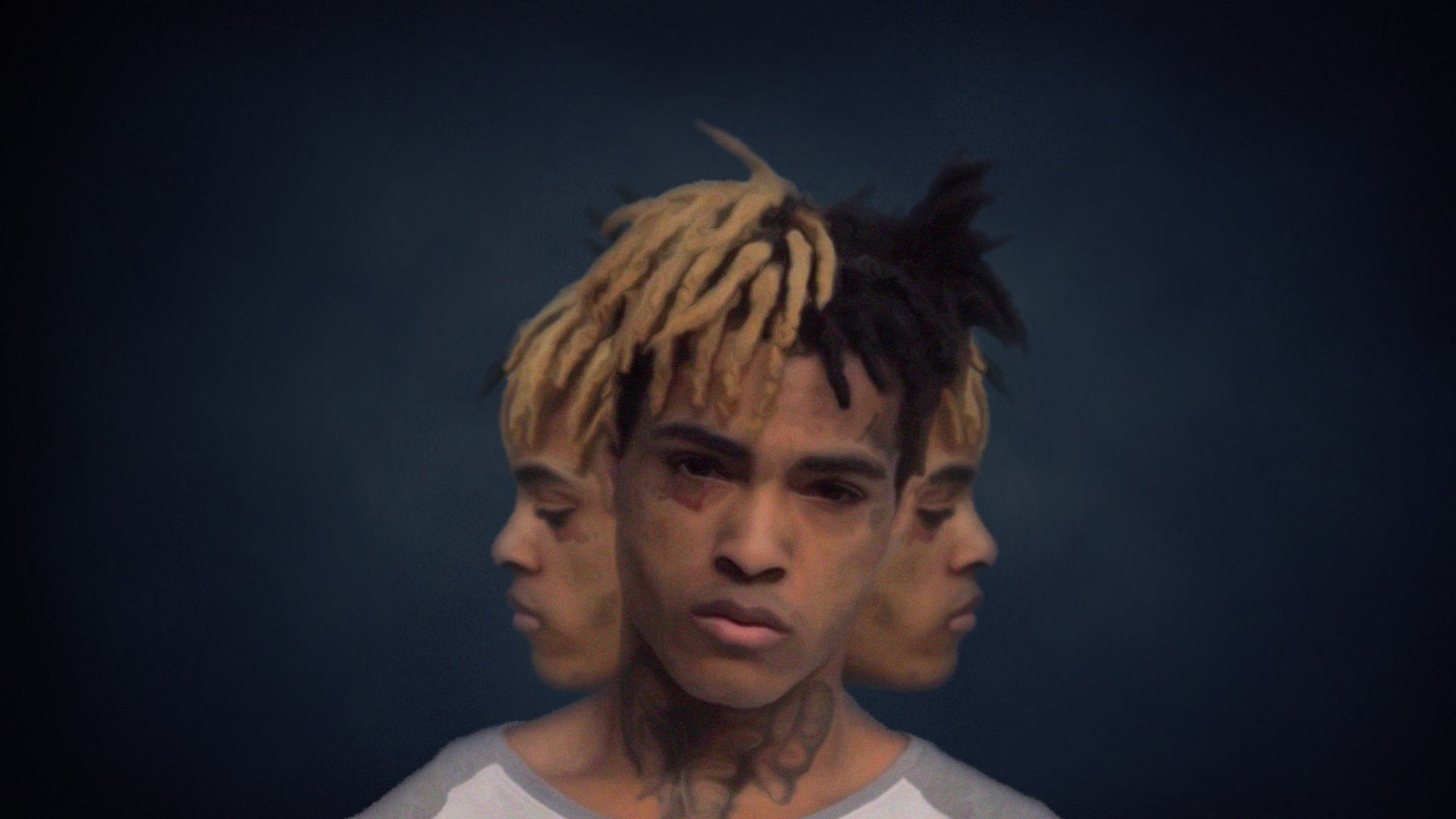 A stylized portrait of XXXTentacion against a dark blue backdrop. The image features a unique triple exposure effect, giving the impression of three faces merged into one. His signature half-blonde, half-black dreadlocks are prominent