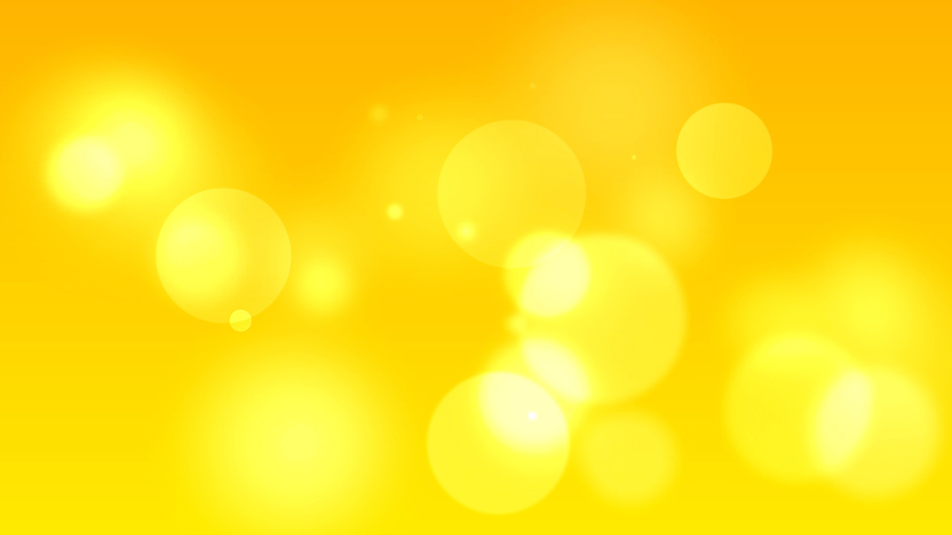 Abstract background with bright yellow bokeh effect, perfect for a vibrant and energetic wallpaper