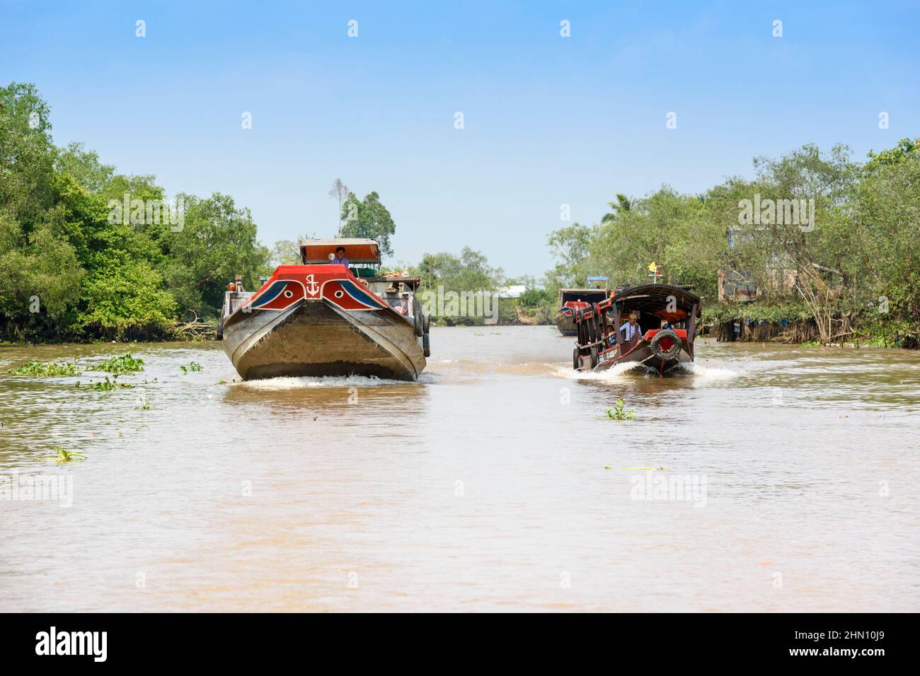 Traditional Wooden Boats On The Mekong River Are Painted With Red