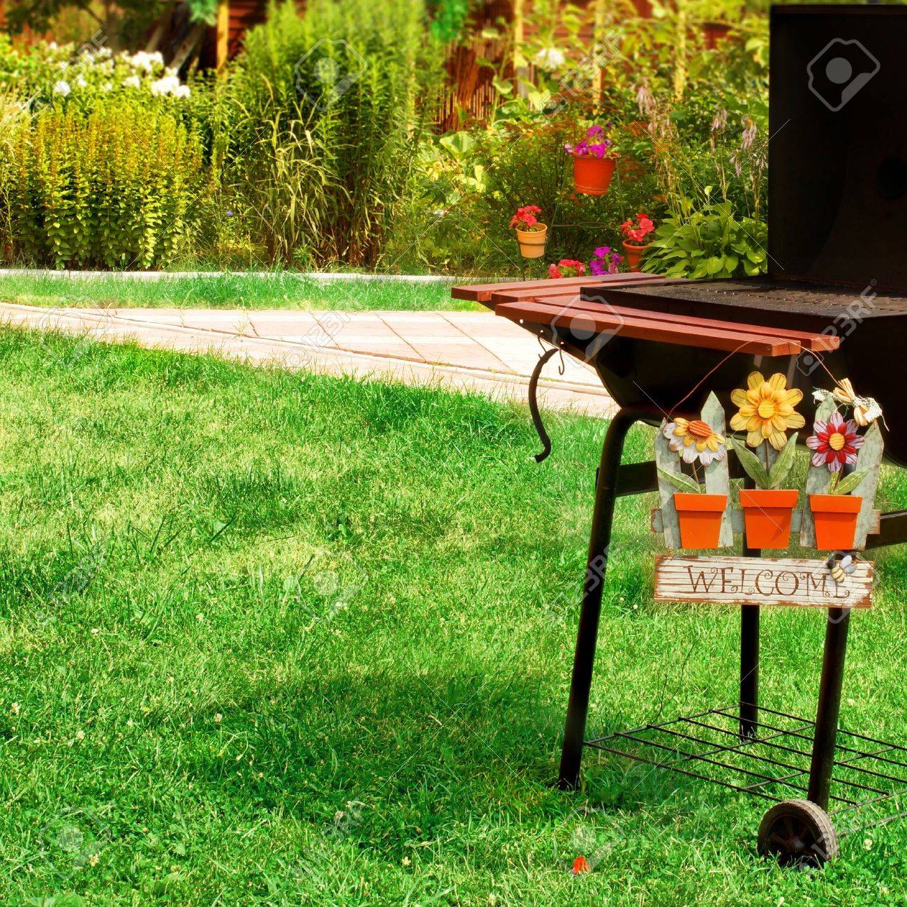 Bbq Grill And Wele Sign In The Backyard Background With Space