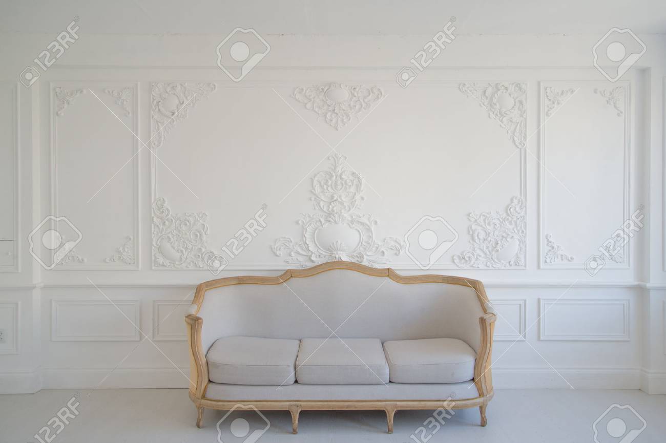 Antique White Sofa Fretwork Wall On Background Stock Photo