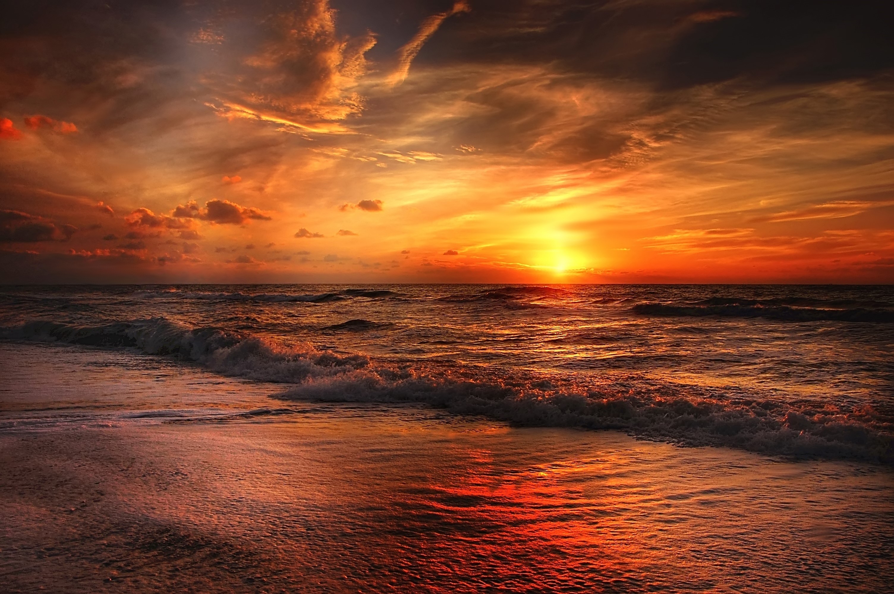 Fiery Sunset Over Ocean Waves