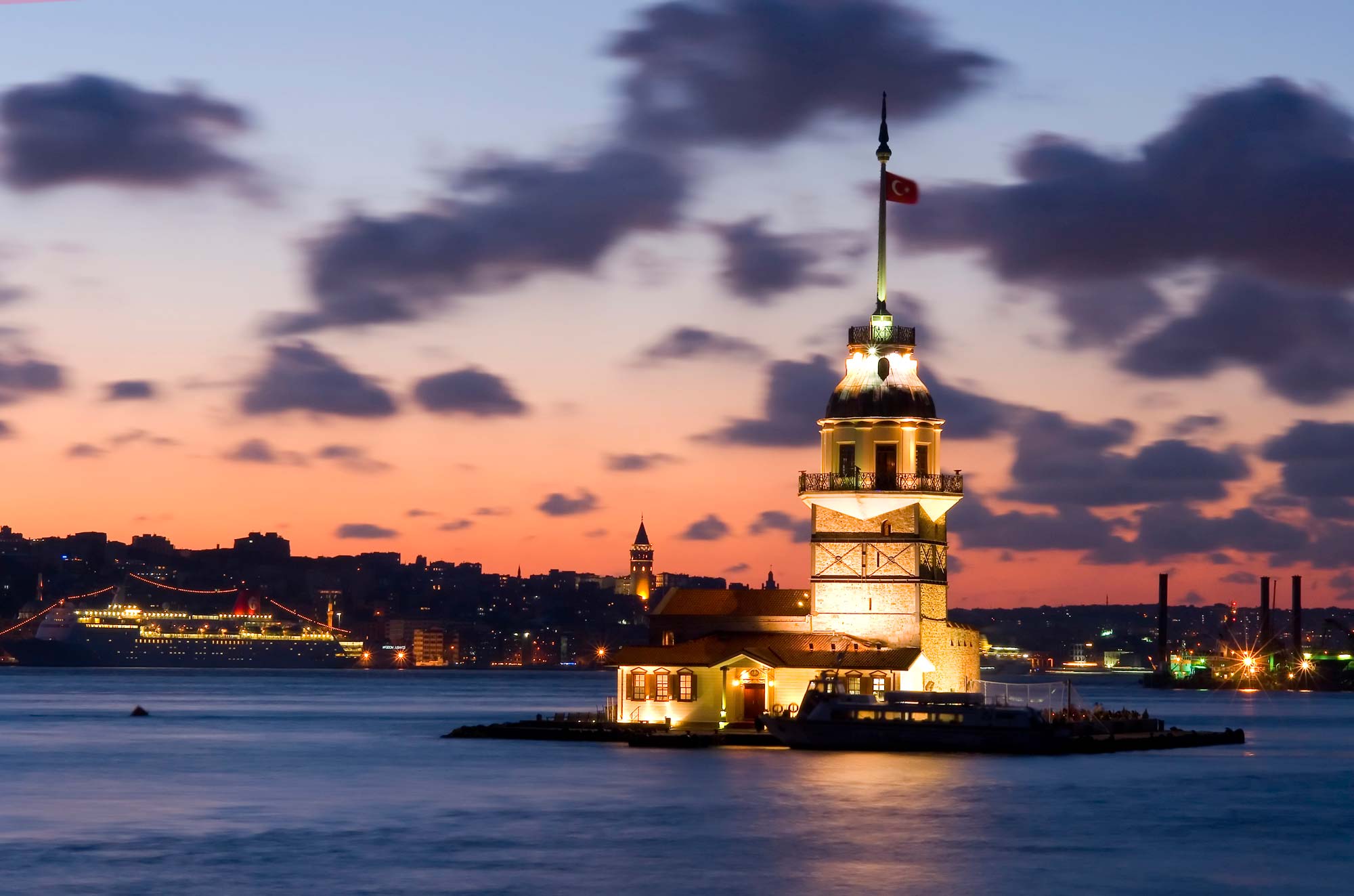 The Maiden's Tower illuminated at sunset on the Bosphorus Strait in Istanbul, Turkey