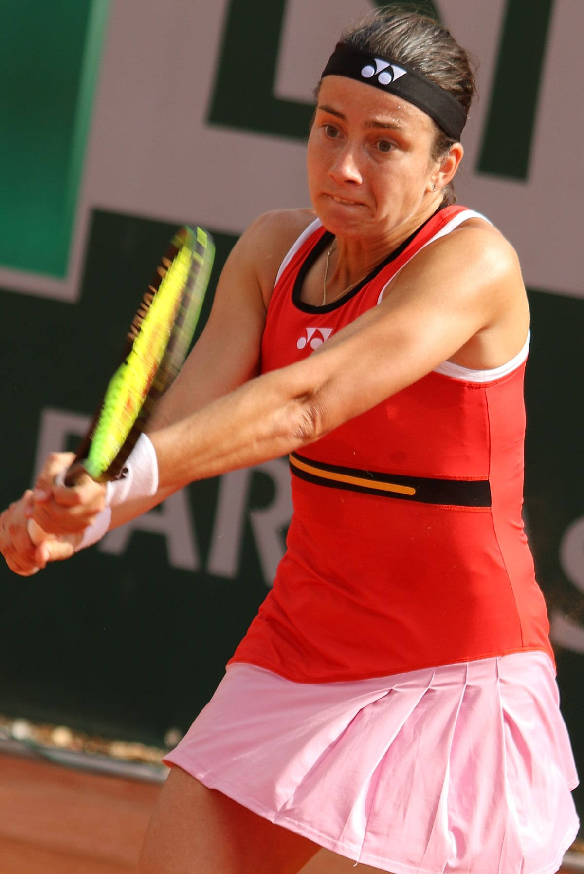Tennis Star Anastasija Sevastova Holding Her Racket Ready On Wallpaper