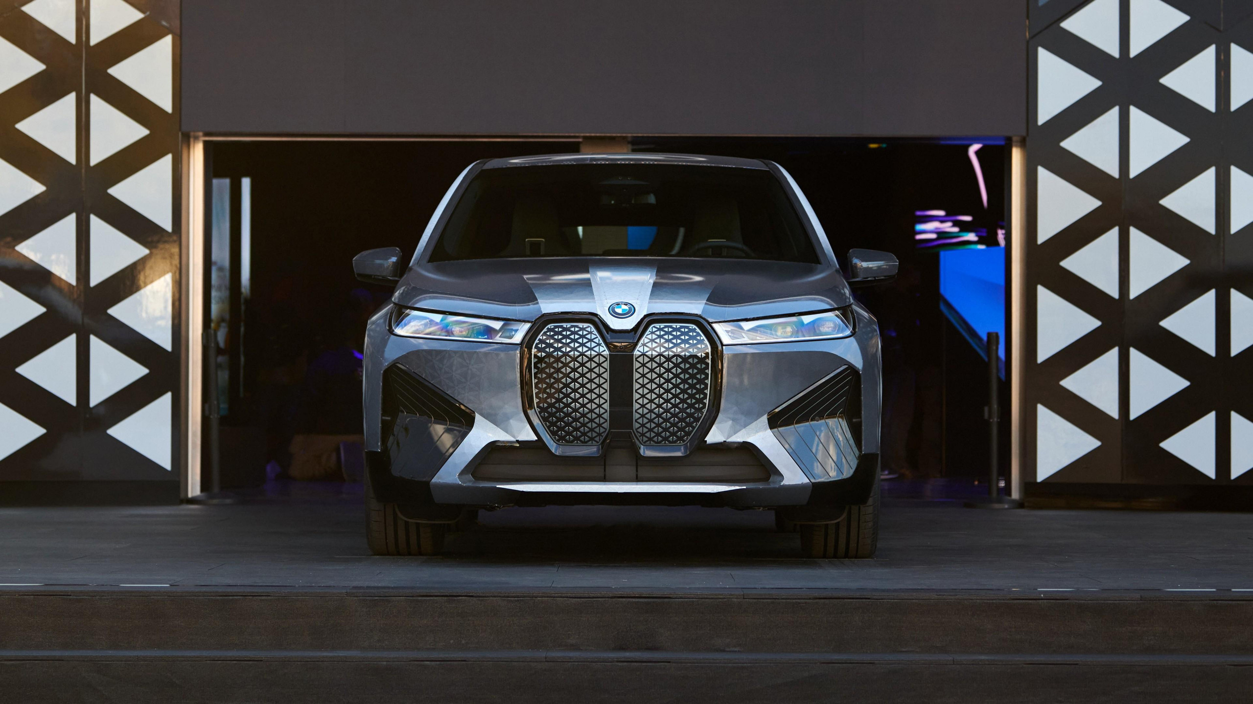 Front view of a BMW iX electric SUV, showcasing its distinctive grille and modern design