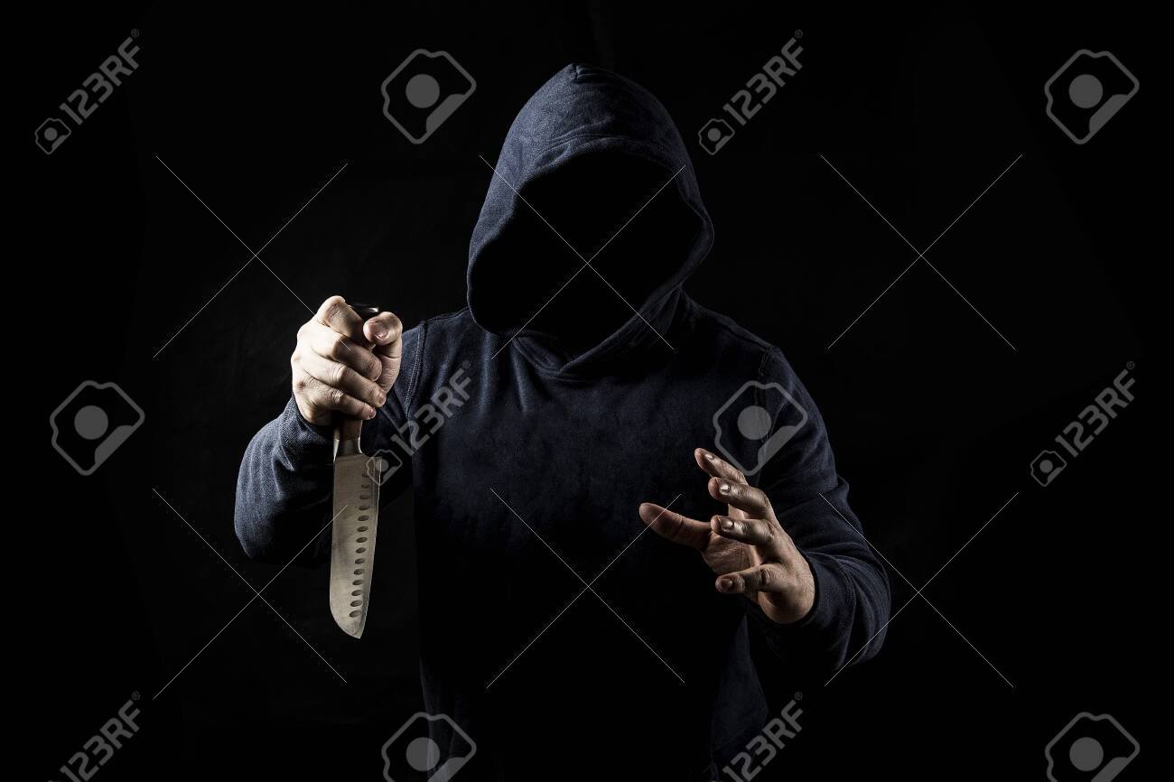 Bandit With Knife On Dark Background Stock Photo Picture And