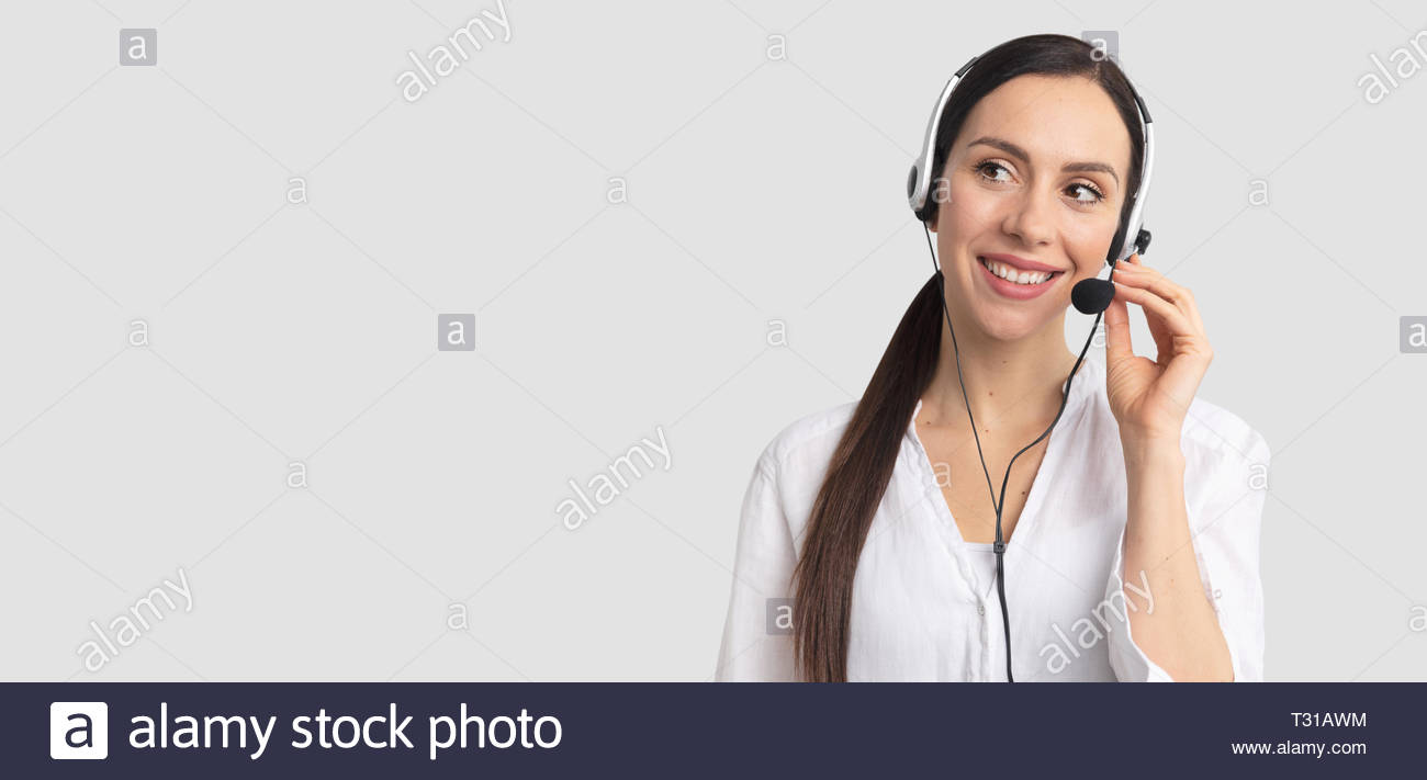 Consultant Of Call Center In Headphones On Gray Background