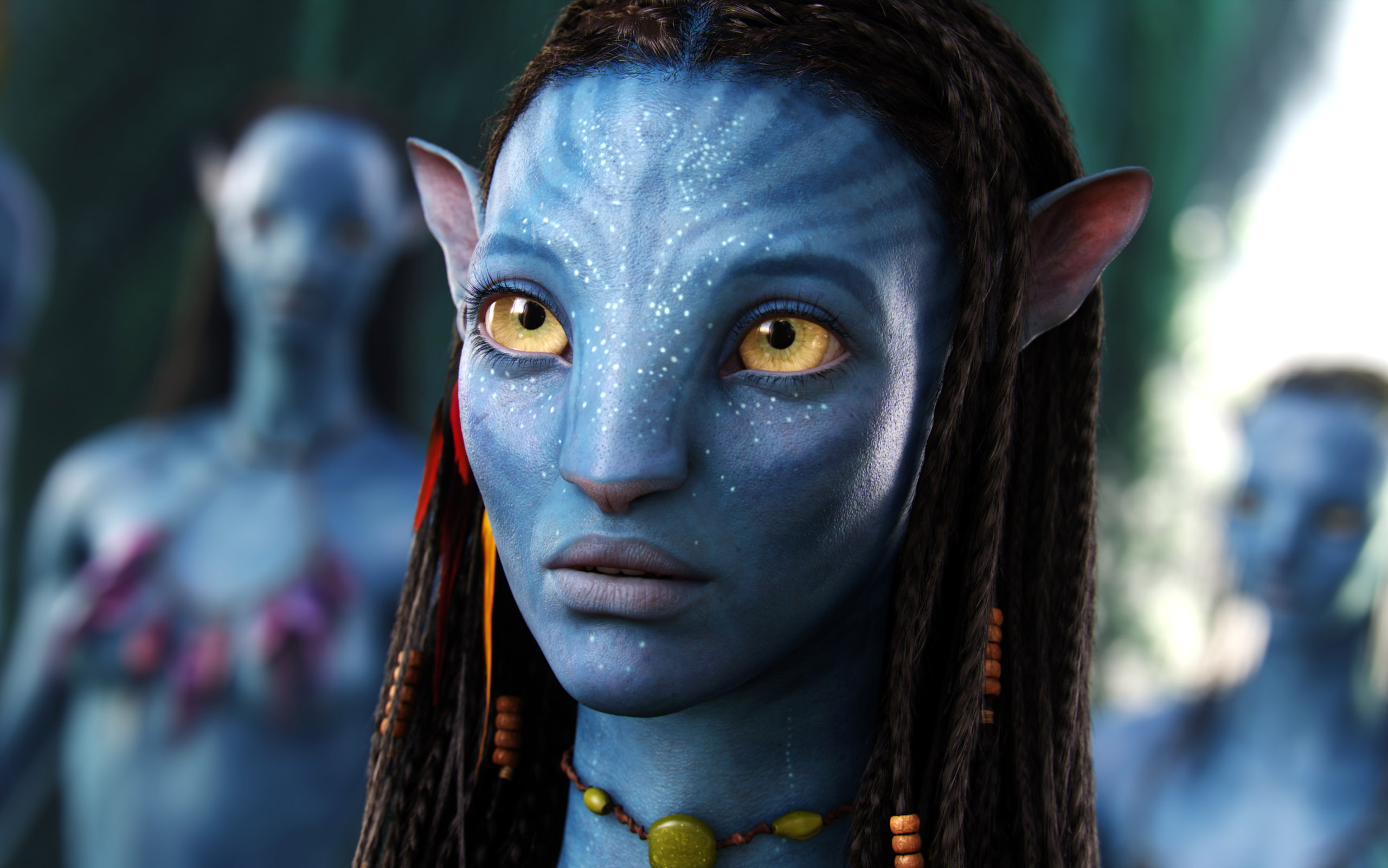 Neytiri from Avatar, a Na'vi princess, looking intensely with her piercing yellow eyes