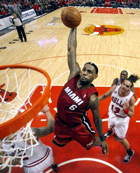 Miami Heat Forward Lebron James Dunks Against The Chicago Bulls During
