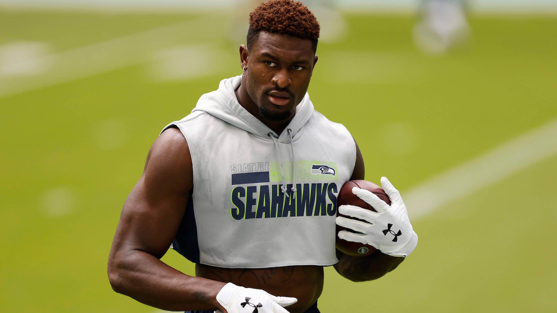 Seattle Seahawks Star Dk Metcalf In Casual White Attire Wallpaper