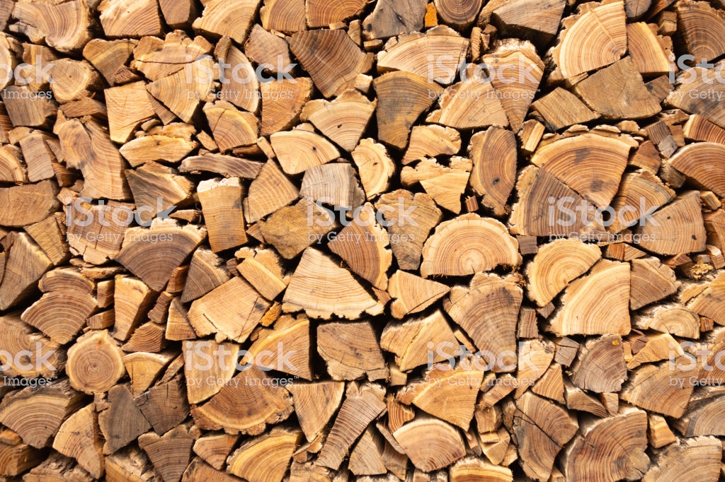Creative Brown Background Of Neatly Stacked Firewood Texture