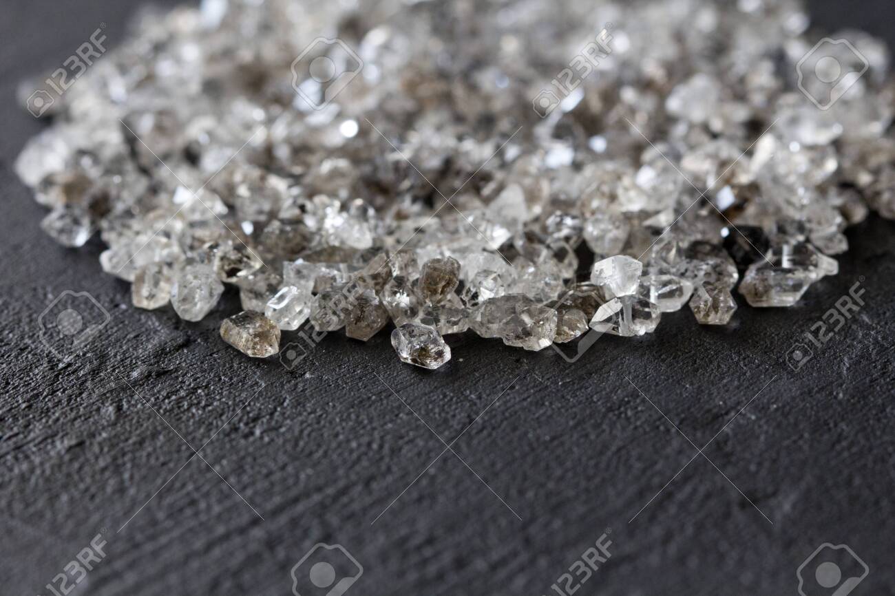 Scattered Diamonds On A Black Background Raw And Mining