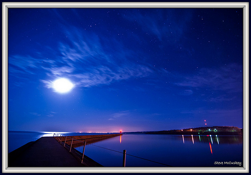  MN USA shipping entry at night bright moon and lights from Duluth