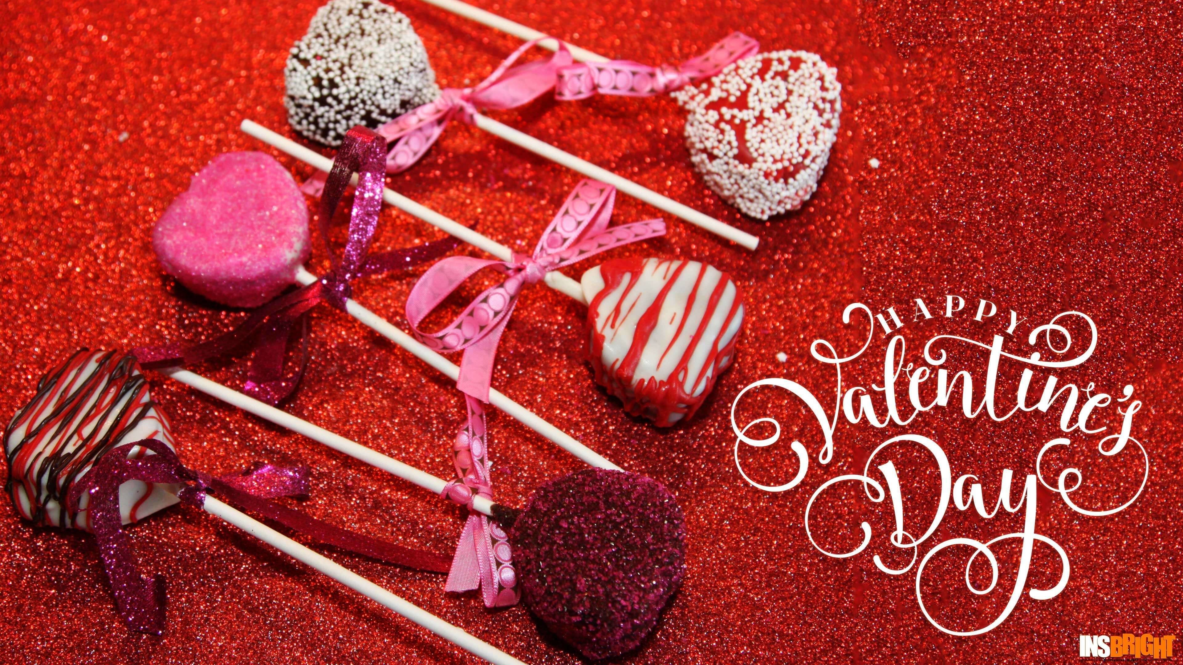 Delicious Valentine's Day Cake Pops on a Sparkling Red Background