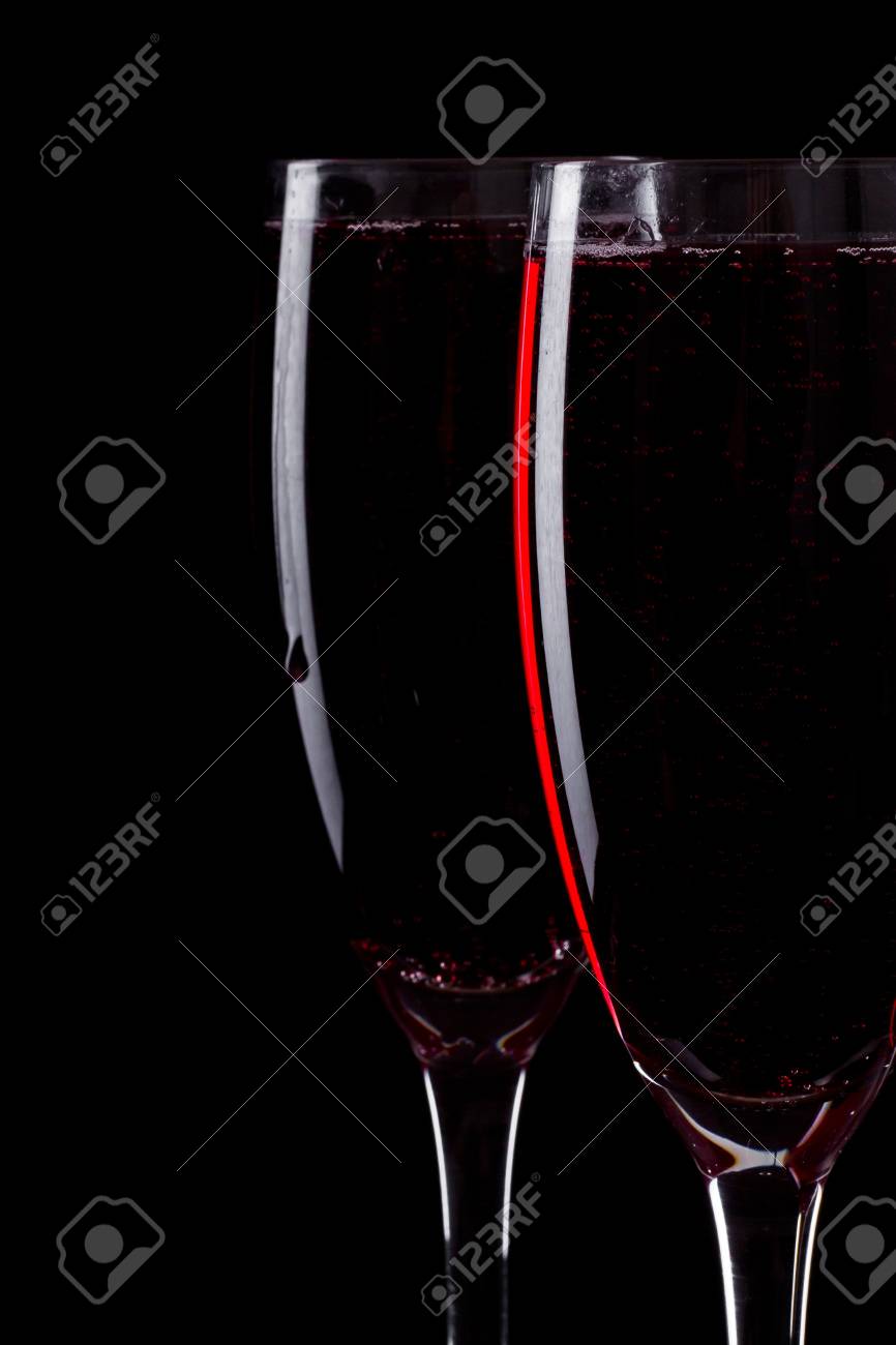 Free download Closeup Of Two Champagne Flutes Over A Black Background