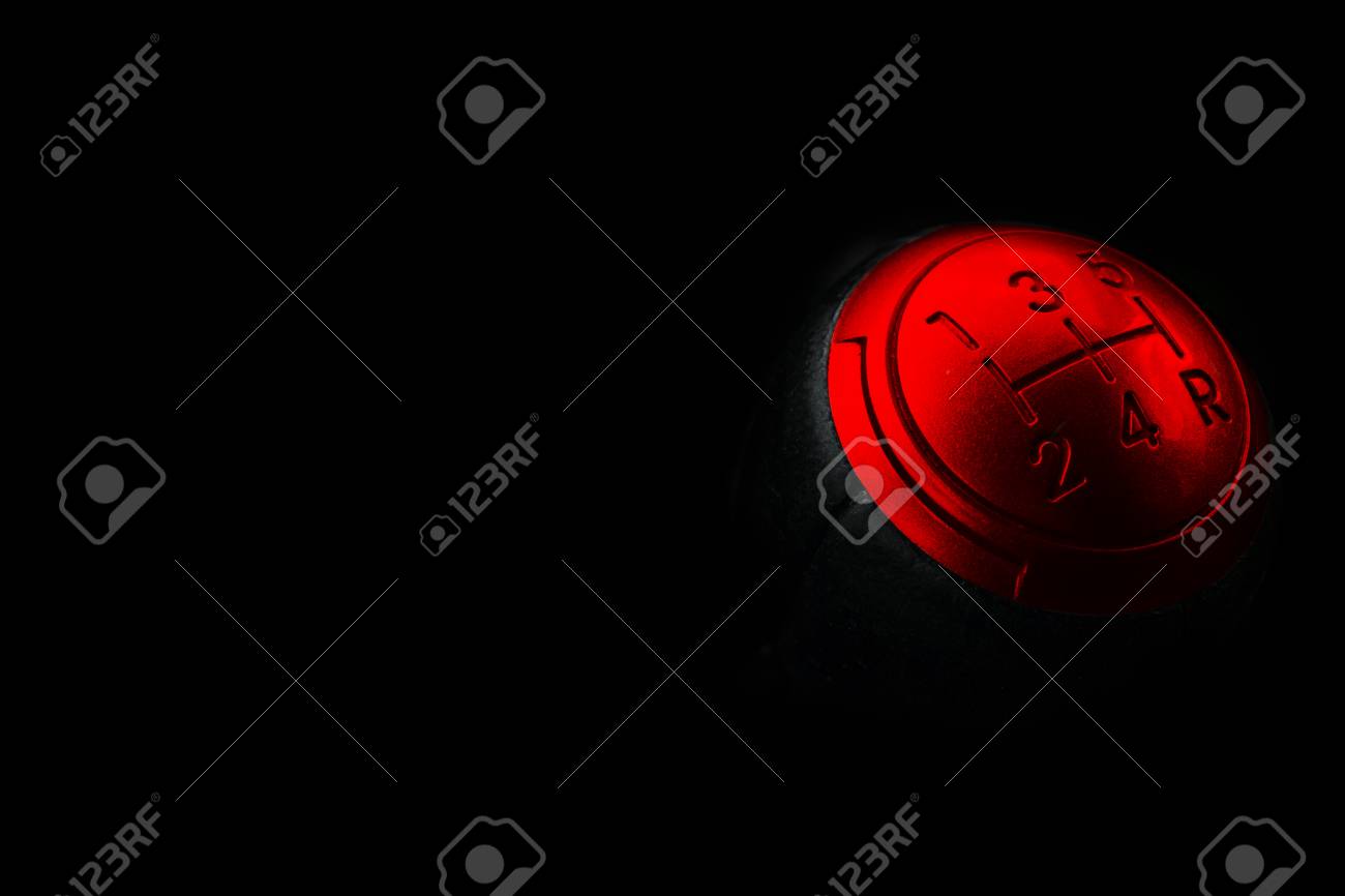 Close Up Of A Red Gear Lever Shift Isolated On Black