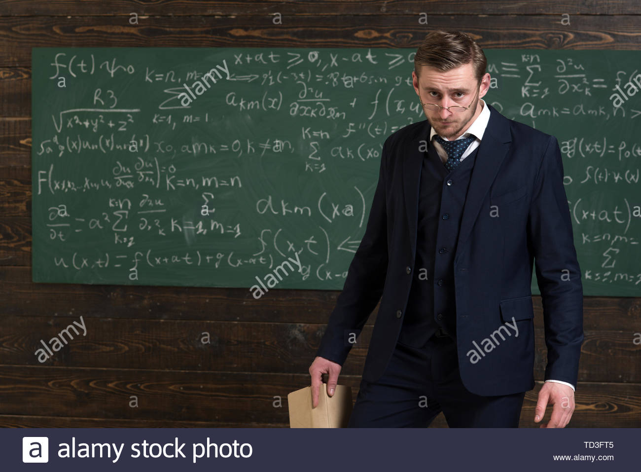 Exacting teacher Teacher formal wear and glasses looks smart
