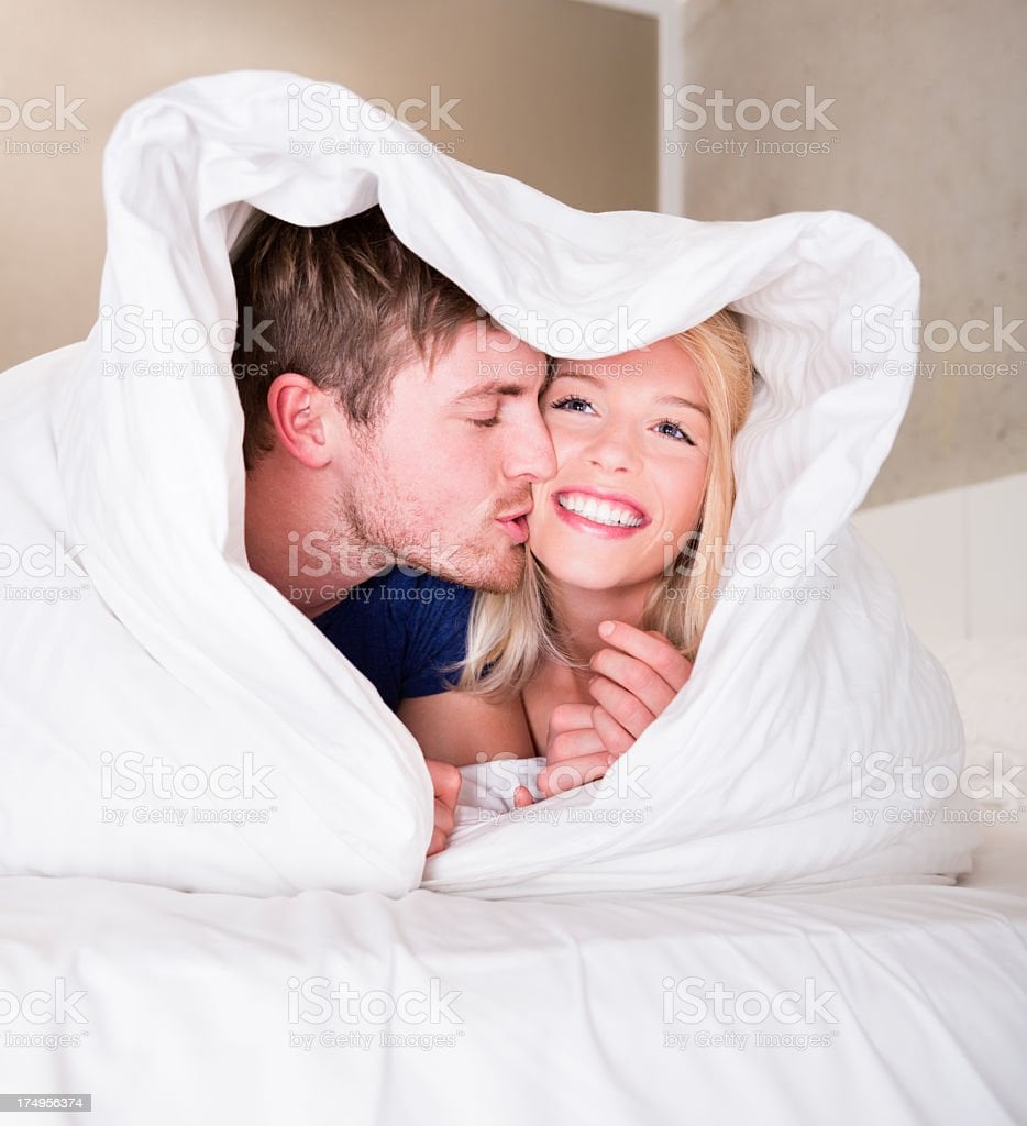 Happy Young Couple Having Fun Under Blanket Stock Photo   Download