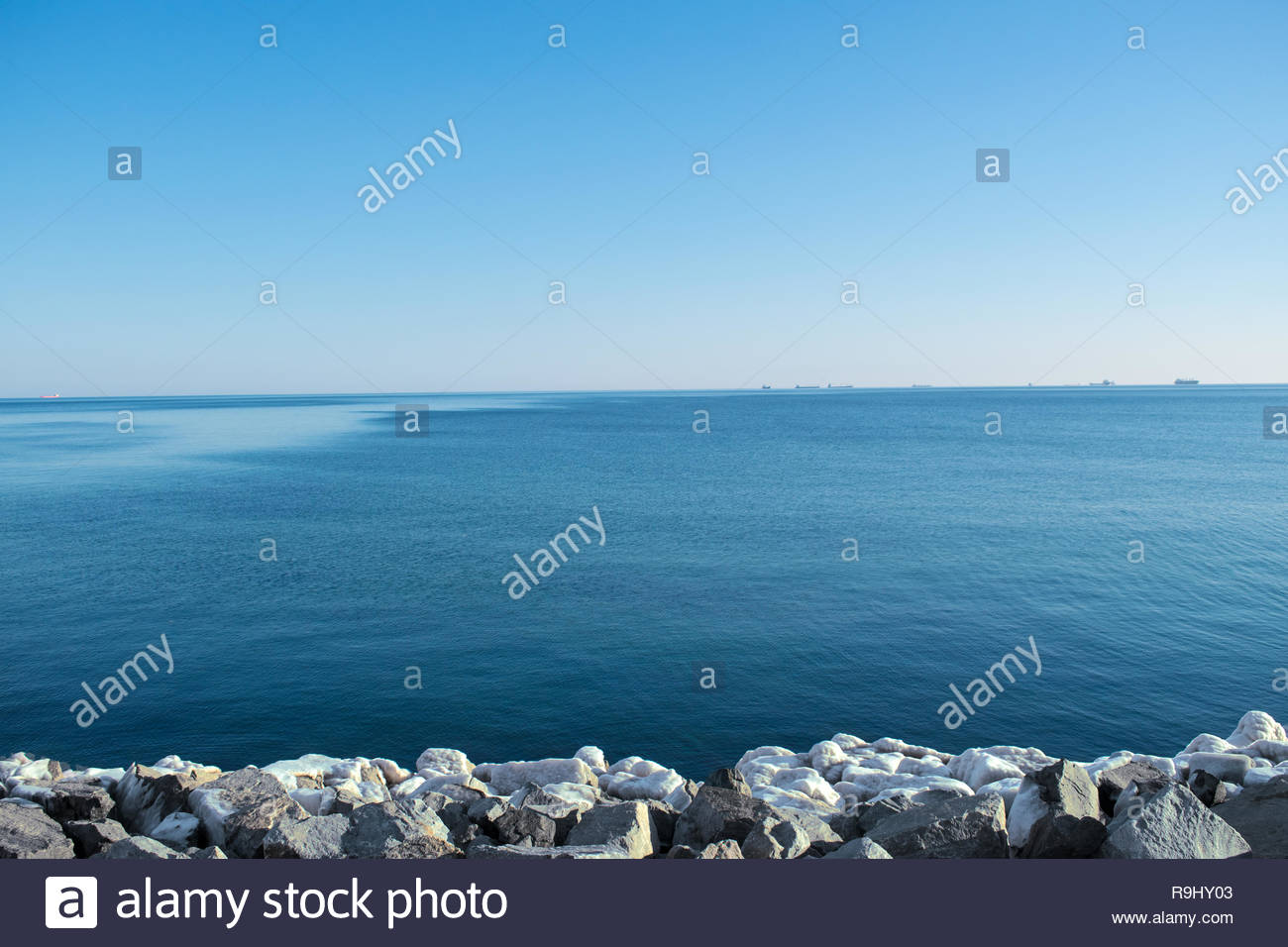 Beautiful Scenic Of The Waterfront Azure Sea And Rocky Beach