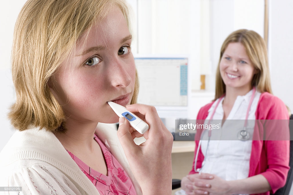 Worried Girl Holding Thermometer In Mouth With Nurse Background