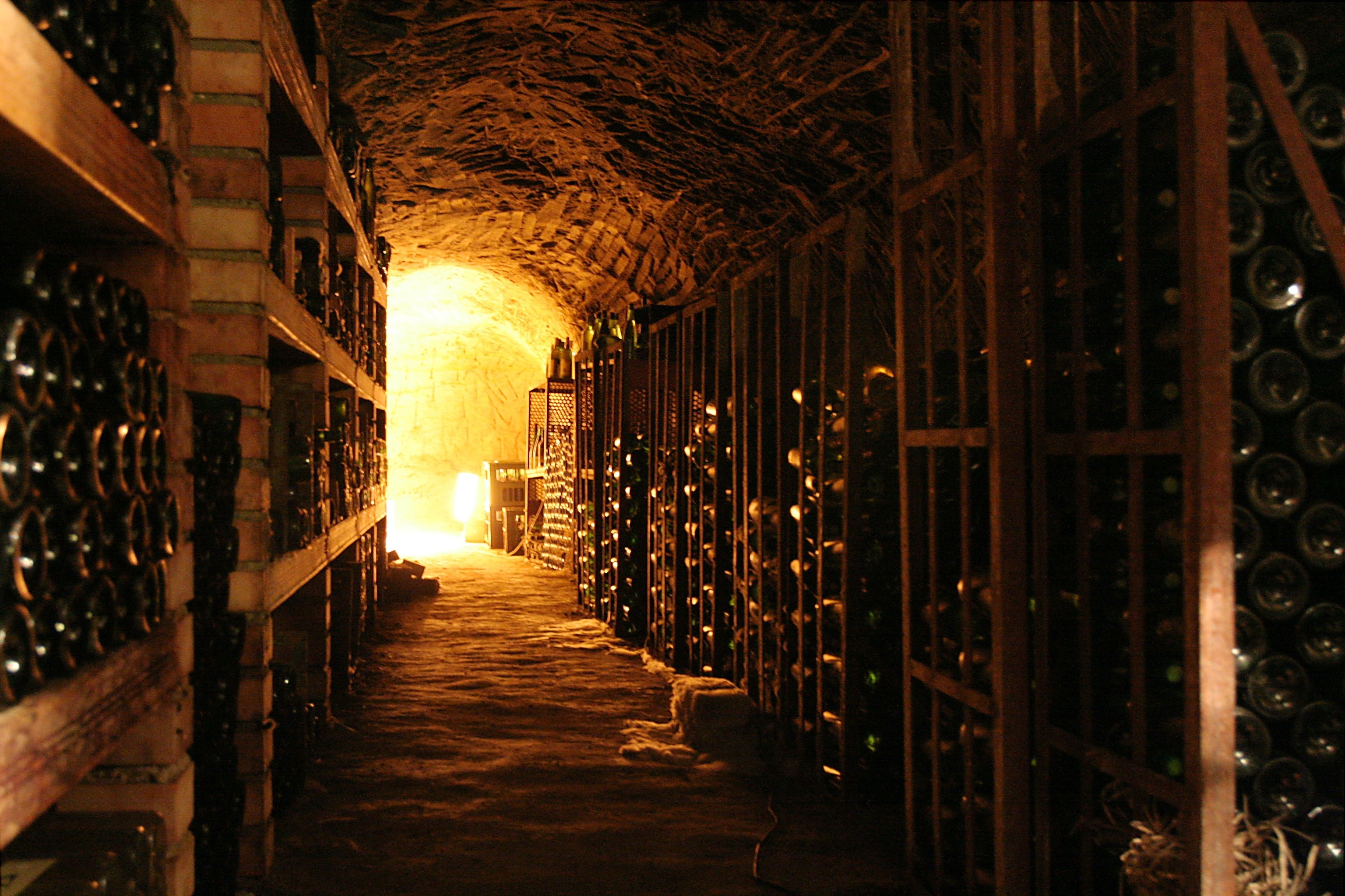 Wallpaper cozy wine cellar with long rows of shelves 3072h2048 3072x2048