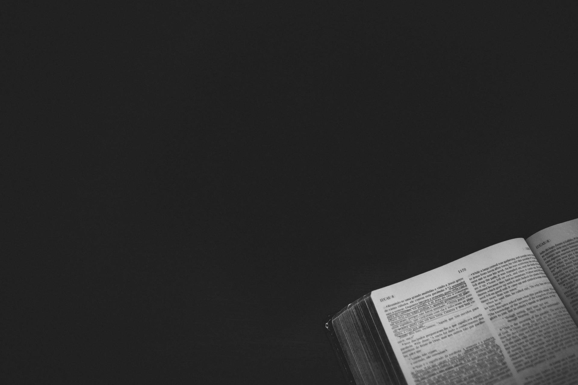 Open Bible On A Black Wallpaper