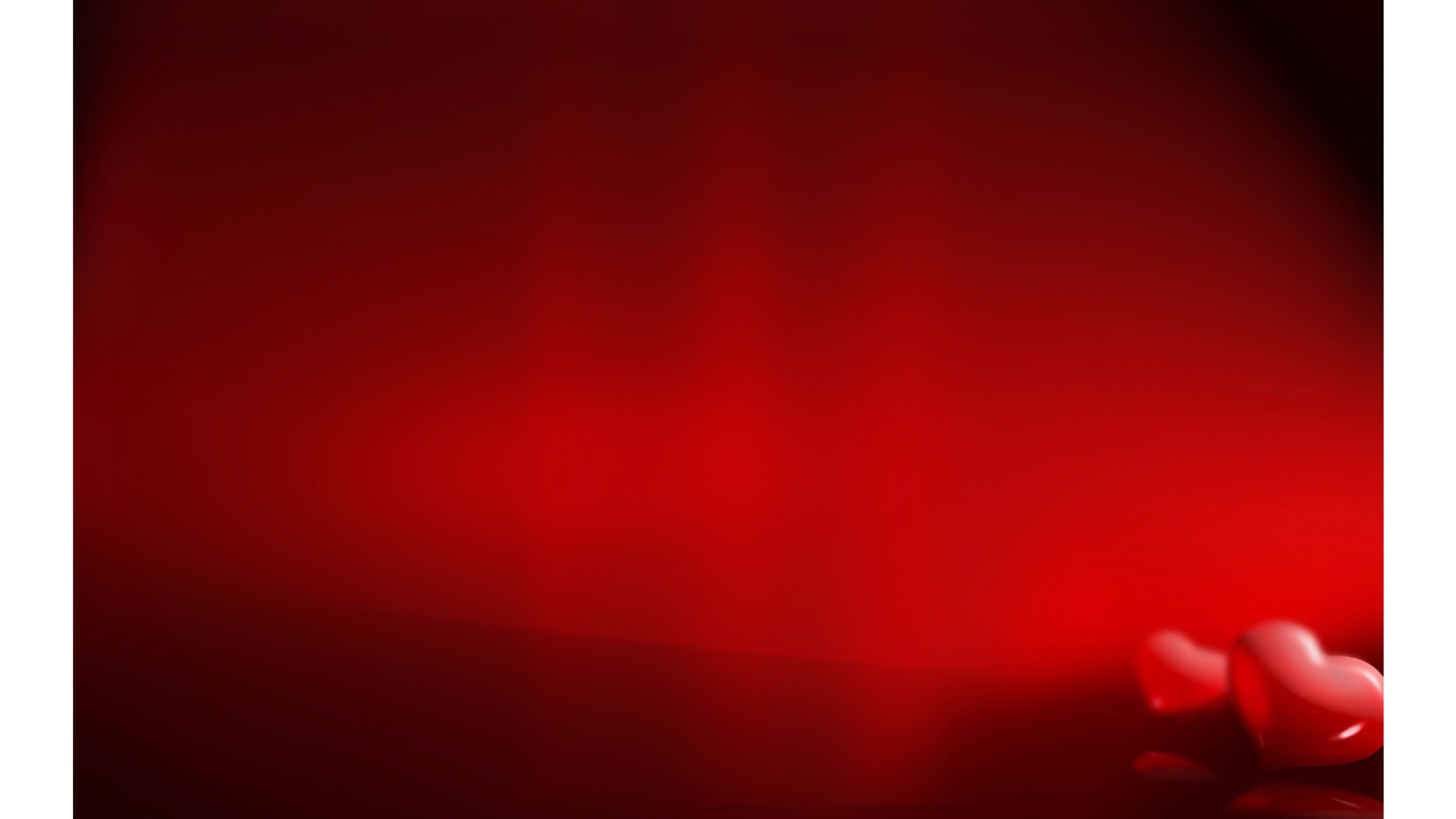 Two blurred red hearts on a vibrant red background, perfect for Valentine's Day