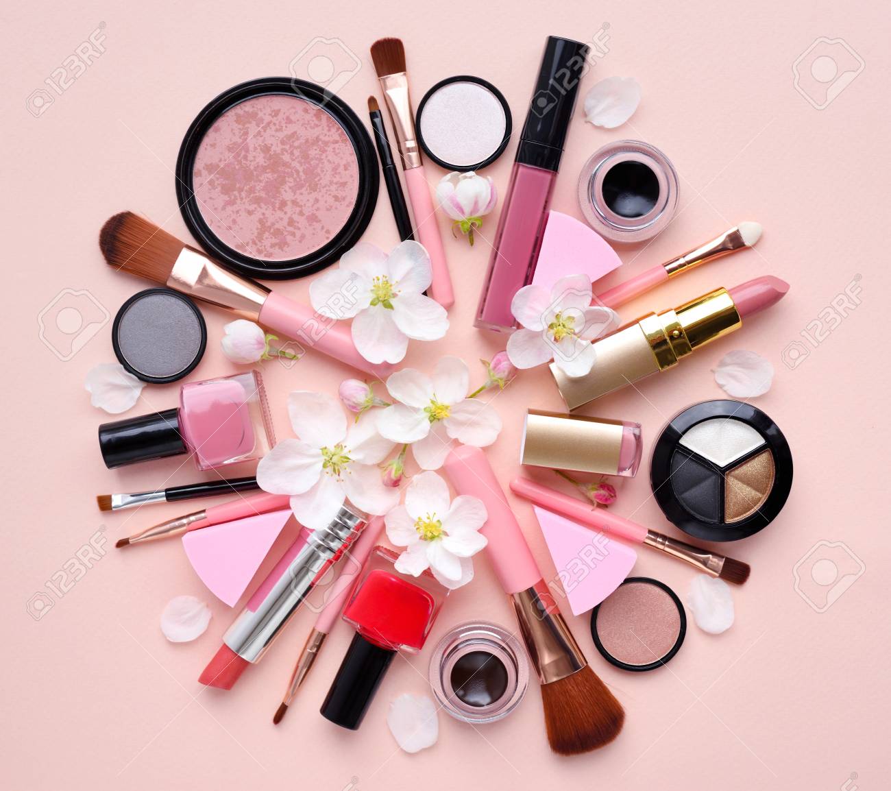 Decorative Cosmetics With Apple Blossom On A Pastel Pink