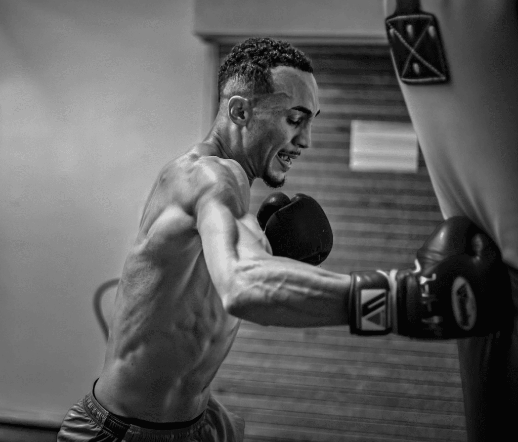Benjamin Whittaker training intensely, showcasing his strength and focus in preparation for a boxing match