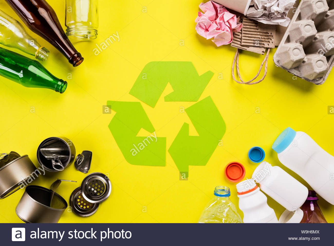 Top Of Different Garbage Materials With Recycling Symbol On