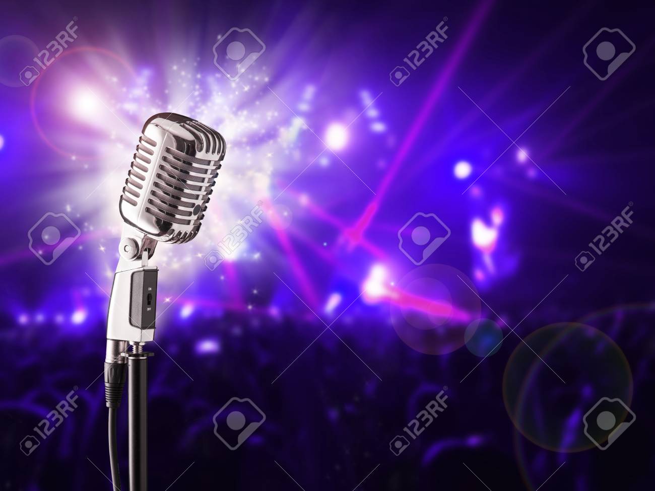 Retro Microphone Ready For Singer Blur Crowd Of People On