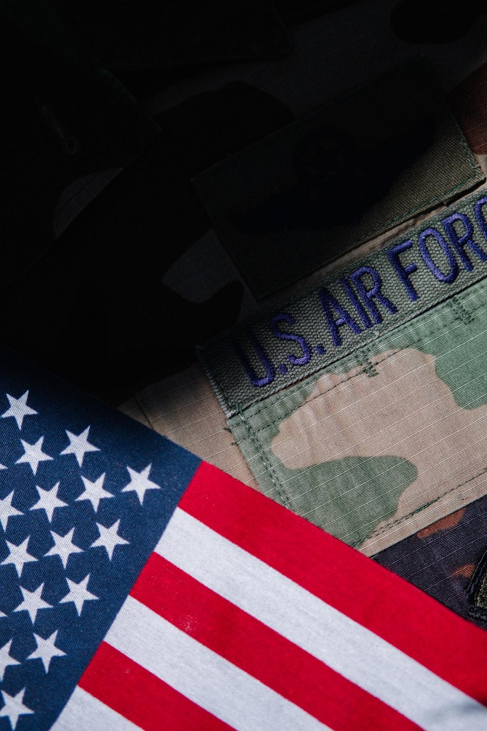 A Close Up Of Us Army Uniform And An American Flag Photo