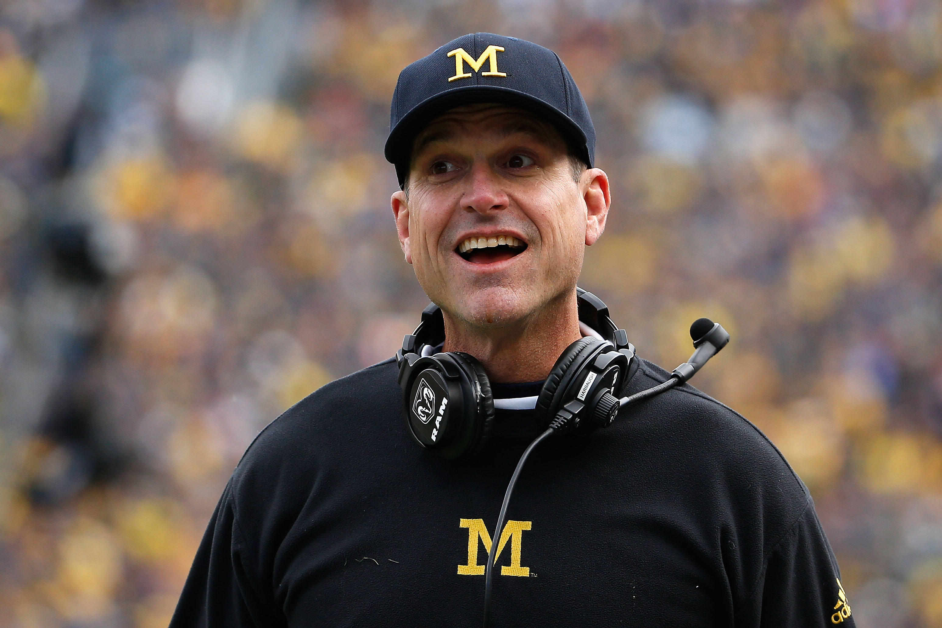Michigan Coach Jim Harbaugh Joins The Chain Crew While Recruiting