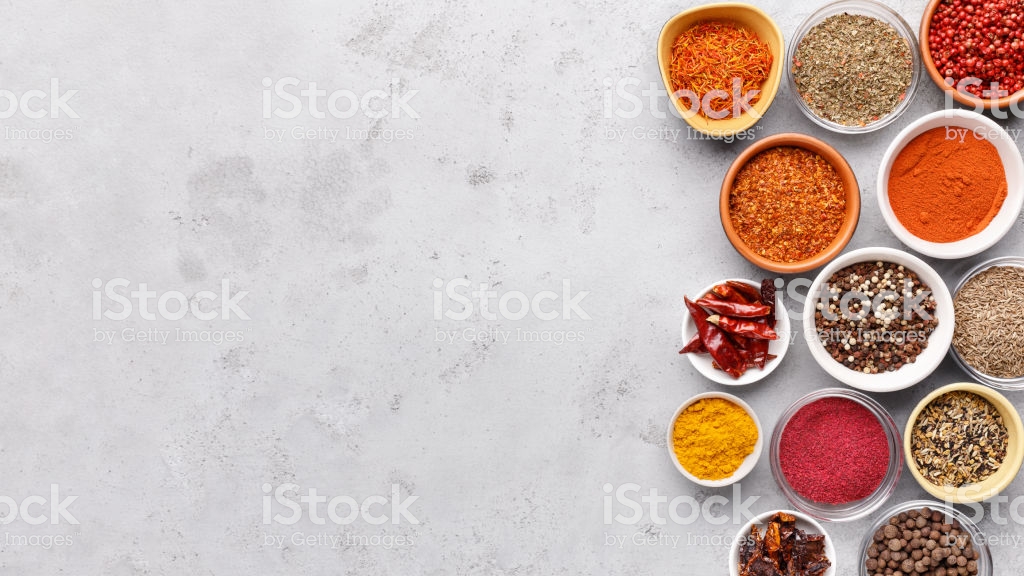 Traditional Indian Spices In Bowls On Grey Background Stock Photo