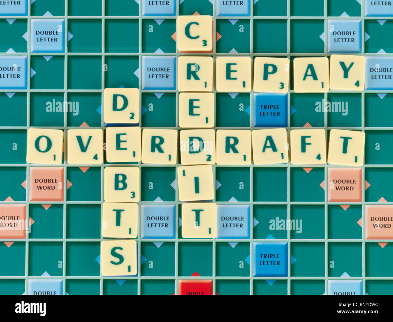 Scrabble Board With Debts Stock Photo