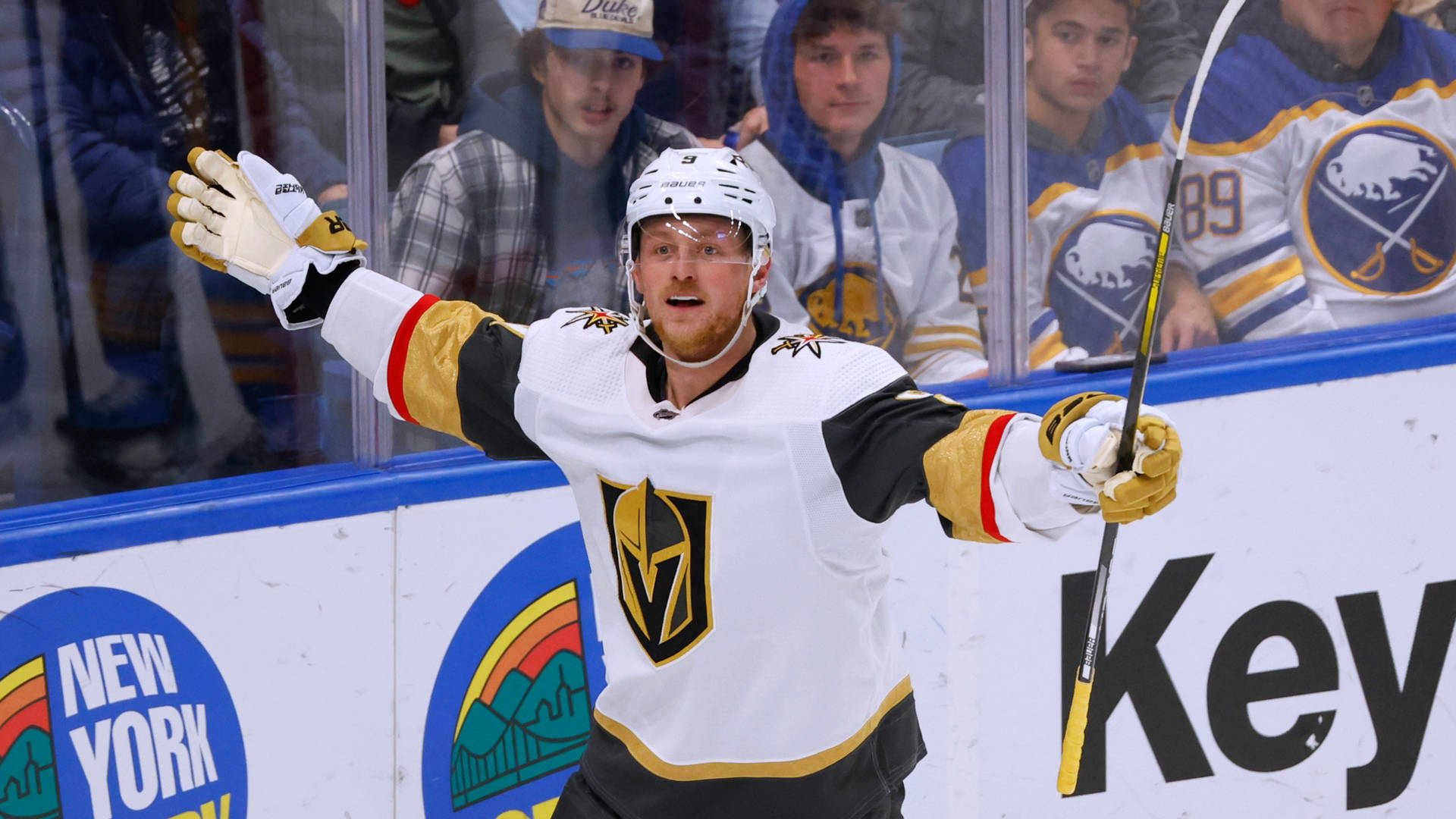 Jack Eichel A Golden Knight Embracing Victory Wallpaper