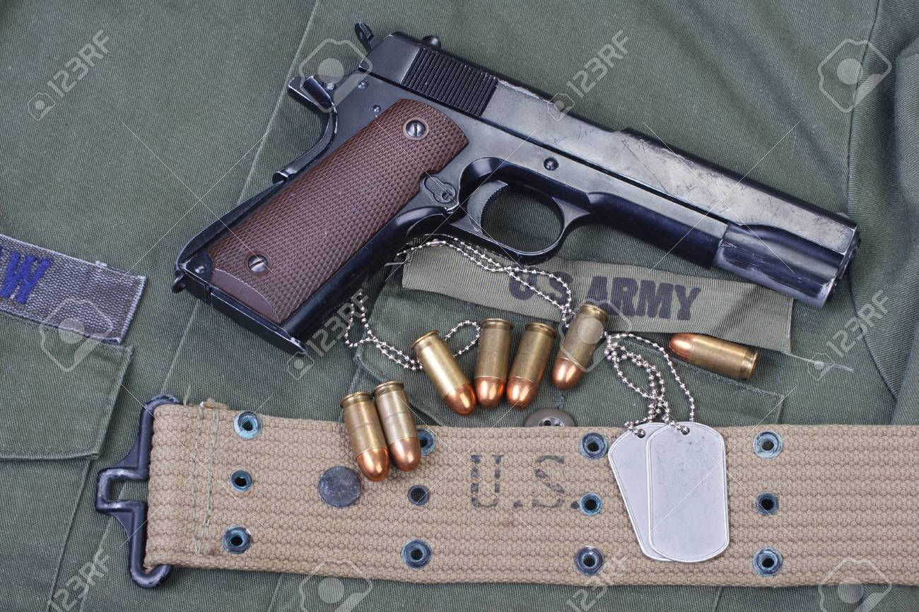 Government M1911 With Us Army Uniform Texture Background Stock