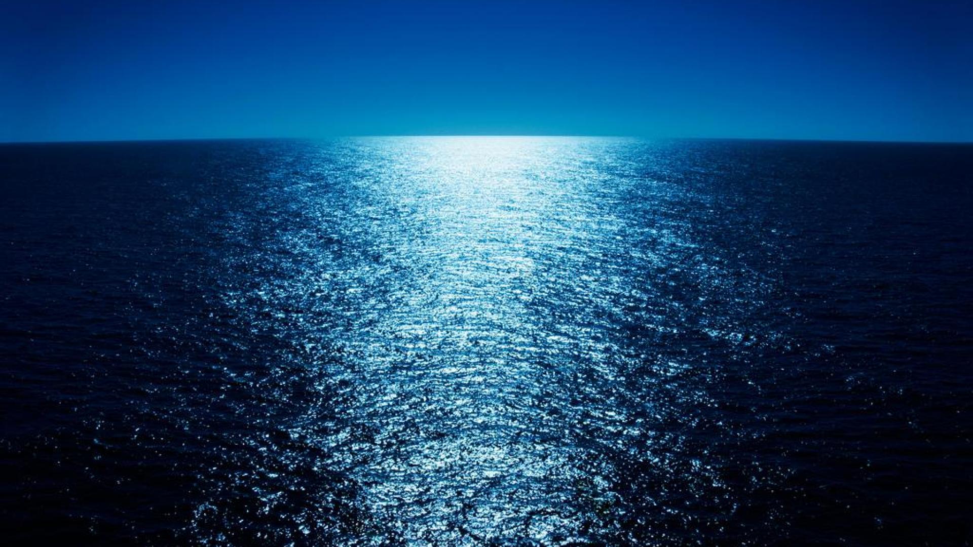 Moonlight Reflecting Across The Ocean Wallpaper