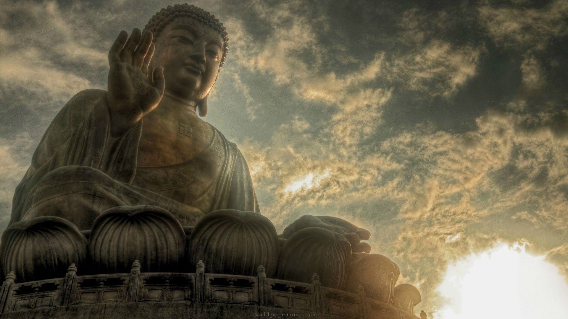 Majestic Buddha Statue against a Cloudy Sky