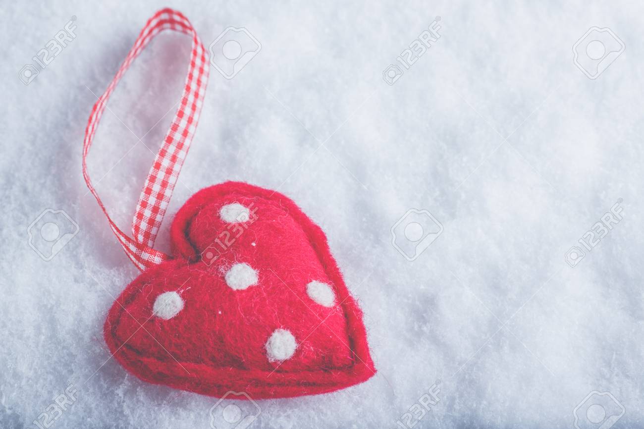 Red Toy Suave Heart On A Frosty White Snow Winter Background