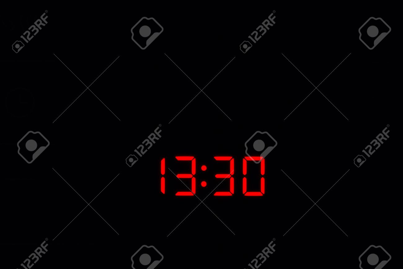 1330 Electronic Time Clock With Red Illumination On Black